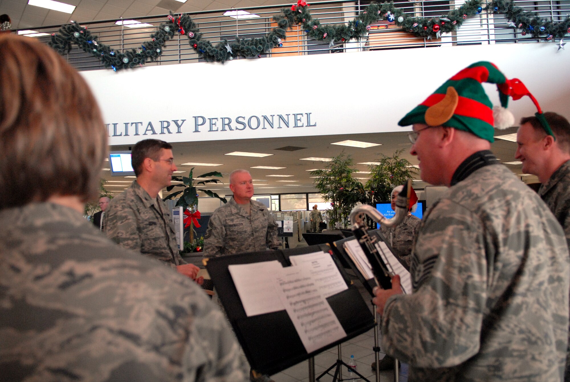 Col. Greg Schwab, commander, 95th Air Base Wing (left) and Chief Master Sgt. Bill Thomaston, command chief, 95th ABW, welcome The Golden West Winds to Bldg. 3000, Dec. 14. (U.S. Air Force photo by Kate Blais)