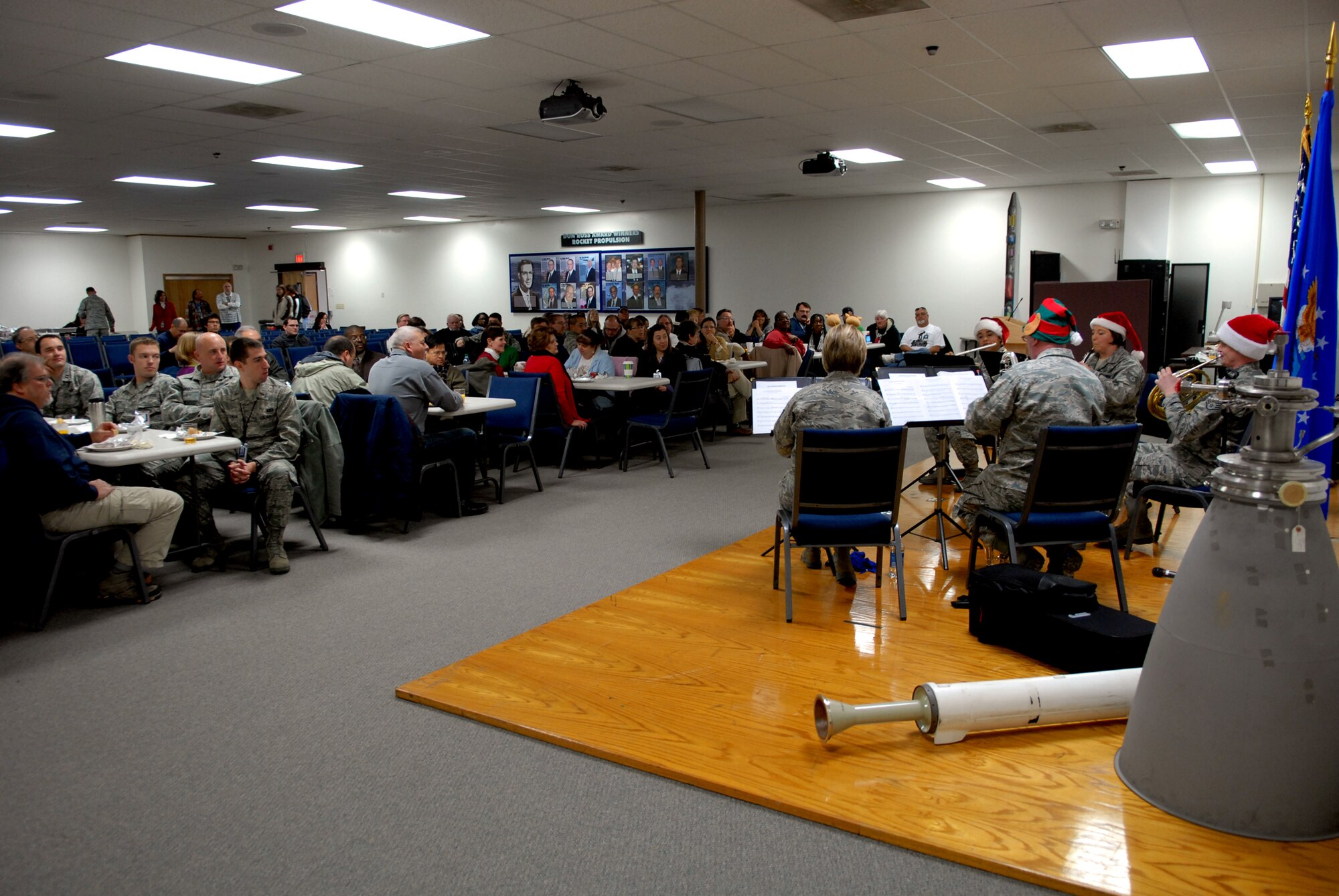 Employees at the Air Force Research Laboratory, Det. 7, pack the Rocket Science Center at AFRL to enjoy holiday tunes courtesy of the Golden West Winds, an ensemble from the Band of the Golden West out of Travis AFB, Calif. (U.S. Air Force photo by Melissa Buchanan)