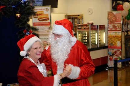 James and Pat Taylor share a dance as Santa and Mrs. Claus at Joint Base San  ntonio-Randolph's Breakfast with Santa event for children Dec. 10. (U.S. Air Force photo/Don Lindsay)
