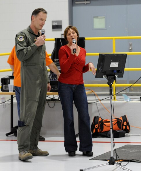 Col. Eric S. Overturf, 442nd Fighter Wing commander, and wife, Karla Overturf, perform karaoke during the 442nd Fighter Wing civilian Christmas party, Dec. 15. The party is an annual morale event for the civilian employees and air reserve technicians in the wing. The 442nd Fighter Wing is an A-10 Thunderbolt II Air Force Reserve unit at Whiteman Air Force Base, Mo. (U.S. Air Force photo/Staff Sgt. Danielle Wolf)