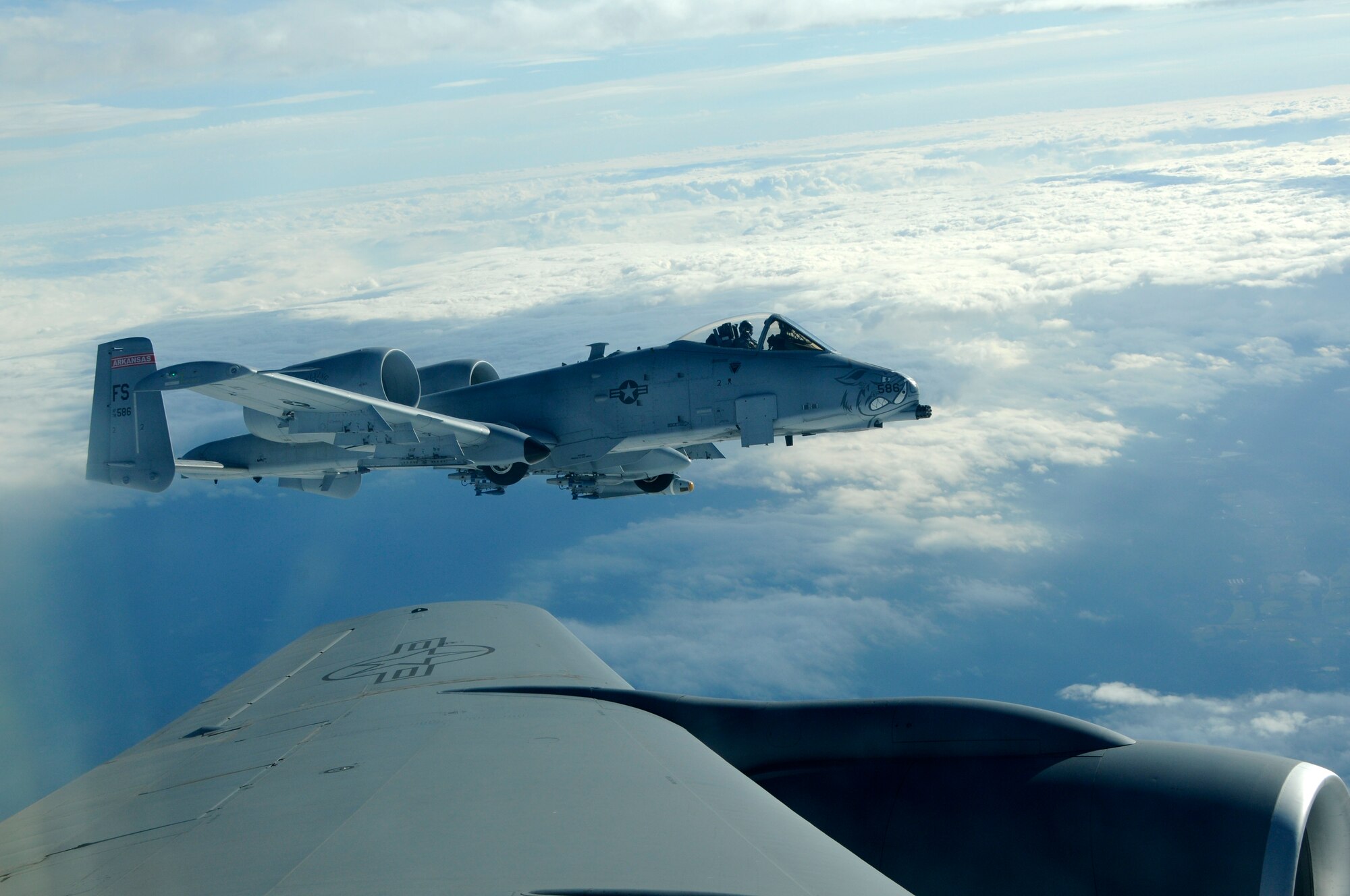 The 188th Fighter Wing, Arkansas Air National Guard conducted spouse orientation rides on a KC-135R Stratotanker with the 185th Airlift Wing, Iowa Air National Guard Dec. 2-3, 2011, in Fort Smith, Ark. Spouses of 188th members were able to observe the Flying Razorbacks’ A-10C Thunderbolt II “Warthogs” conduct aerial refueling from the KC-135R's boom operation area during the flight. The flight was part of an open house in which 188th family members were afforded the opportunity to fly an A-10 simulator as well as observe A-10 training exercises at the 188th’s Detachment 1 Razorback Range located at Fort Chaffee Maneuver Training Center, Ark. The objective of the program was to showcase the 188th’s mission to family members. (U.S. Air Force photo by Airman 1st Class John Hillier/188th Fighter Wing Public Affairs) 