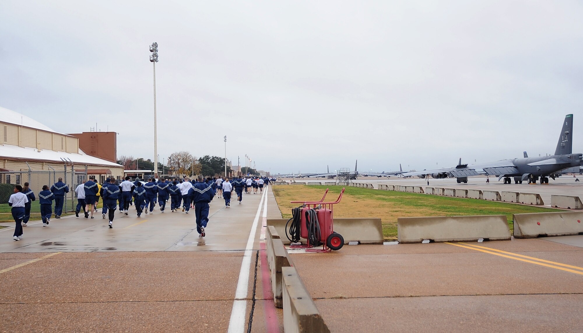 Barksdale Airmen begin the Ham Haul Fun Run Dec. 16 at the flightline on Barksdale Air Force Base, La. More than 80 Airmen participated in the event, only the second time in several years a fun run was held on the base flightline. (U.S. Air Force photo/Senior Airman Amber Ashcraft)(RELEASED)