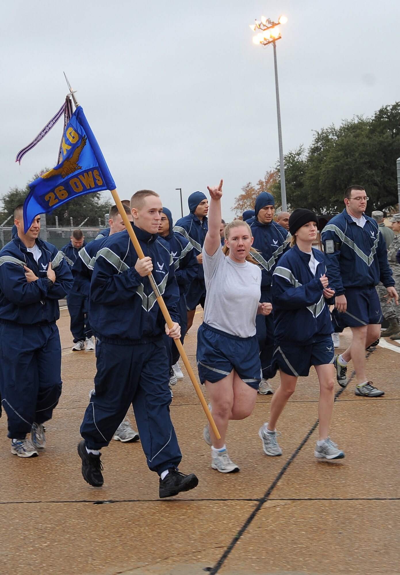 Airmen from the 26th Operational Weather Squadron begin the Ham Haul Fun Run Dec. 16 at the flightline on Barksdale Air Force Base, La. More than 80 Airmen participated in the fun run and prizes were given out during a drawing after the event. Raffled prizes included 30 hams for ticket winners, a digital camera set, portable DVD kit and several workout kits. (U.S. Air Force photo/Senior Airman Amber Ashcraft)(RELEASED)