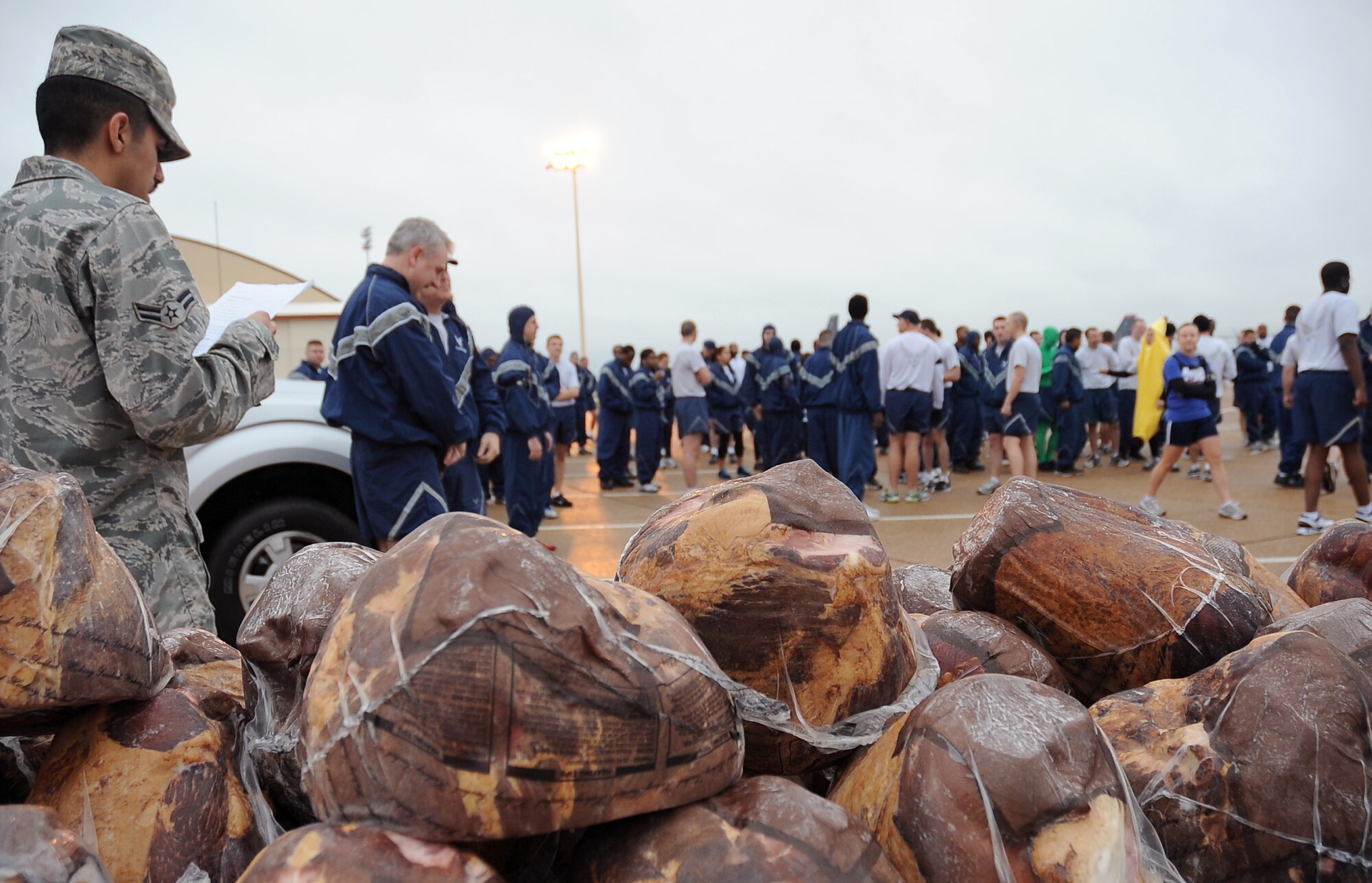 Barksdale Airmen listen to the rules for running on the flightline Dec. 16 prior to the Ham Haul Fun Run on Barksdale Air Force Base, La. More than 80 Airmen participated in the fun run and prizes were given out during a drawing after the event. Raffled prizes included 30 hams for ticket winners, a digital camera set, portable DVD kit and several workout kits. (U.S. Air Force photo/Senior Airman Amber Ashcraft)(RELEASED)