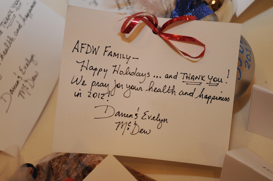 A holiday thank you card signed by Air Force District of Washington Commander Maj. Gen. Darren W. McDew and wife, Evelyn McDew, sits waiting for the next guest to arrive Dec.17 at the AFDW 2011 Holiday Party, Fort McNair, Washington, D.C. (U.S. Air Force photo courtesy of Airman 1st Class Christian Salinas)