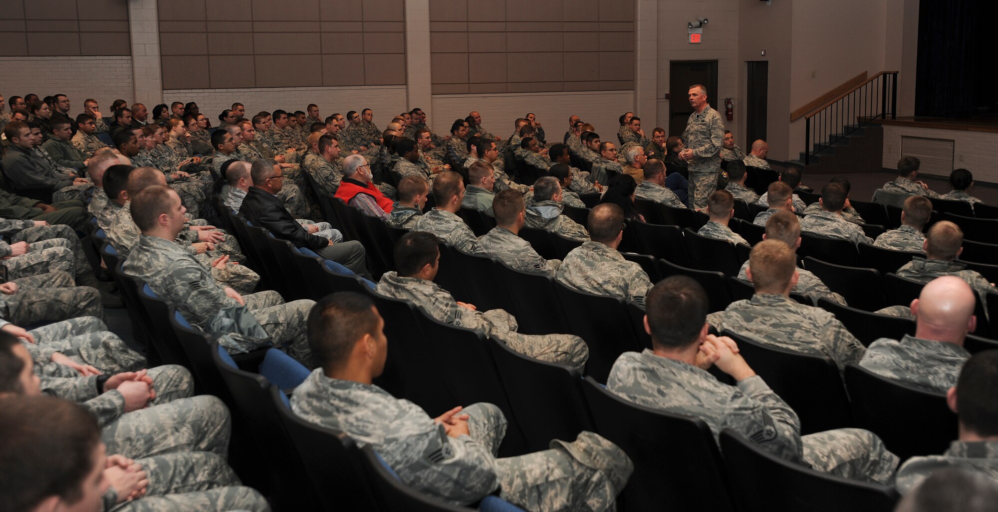 Col. Ricky Rupp, 22nd Air Refueling Wing commander, speaks at a commander’s call in the base theater Dec. 13, 2011, McConnell Air Force Base, Kan.  Commander’s calls are used to distribute Air Force level information, recognize outstanding wing performances and answer Airman’s questions.  (U.S. Air Force photo/Airman 1st Class Jose L. Leon)