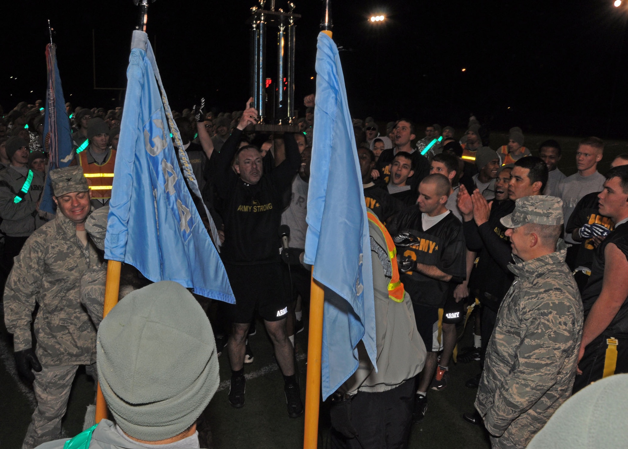 GOODFELLOW AIR FORCE BASE, Texas – John Bonin, 344th Military Intelligence Battalion Commander, hoists the trophy after defeating Navy 45-32 during the Third Annual Army versus Navy flag football game at the base field Dec. 17. Hundreds of servicemembers attended the game to support their team. (U.S. Air Force photo/ Staff Sgt. Tong Duong)