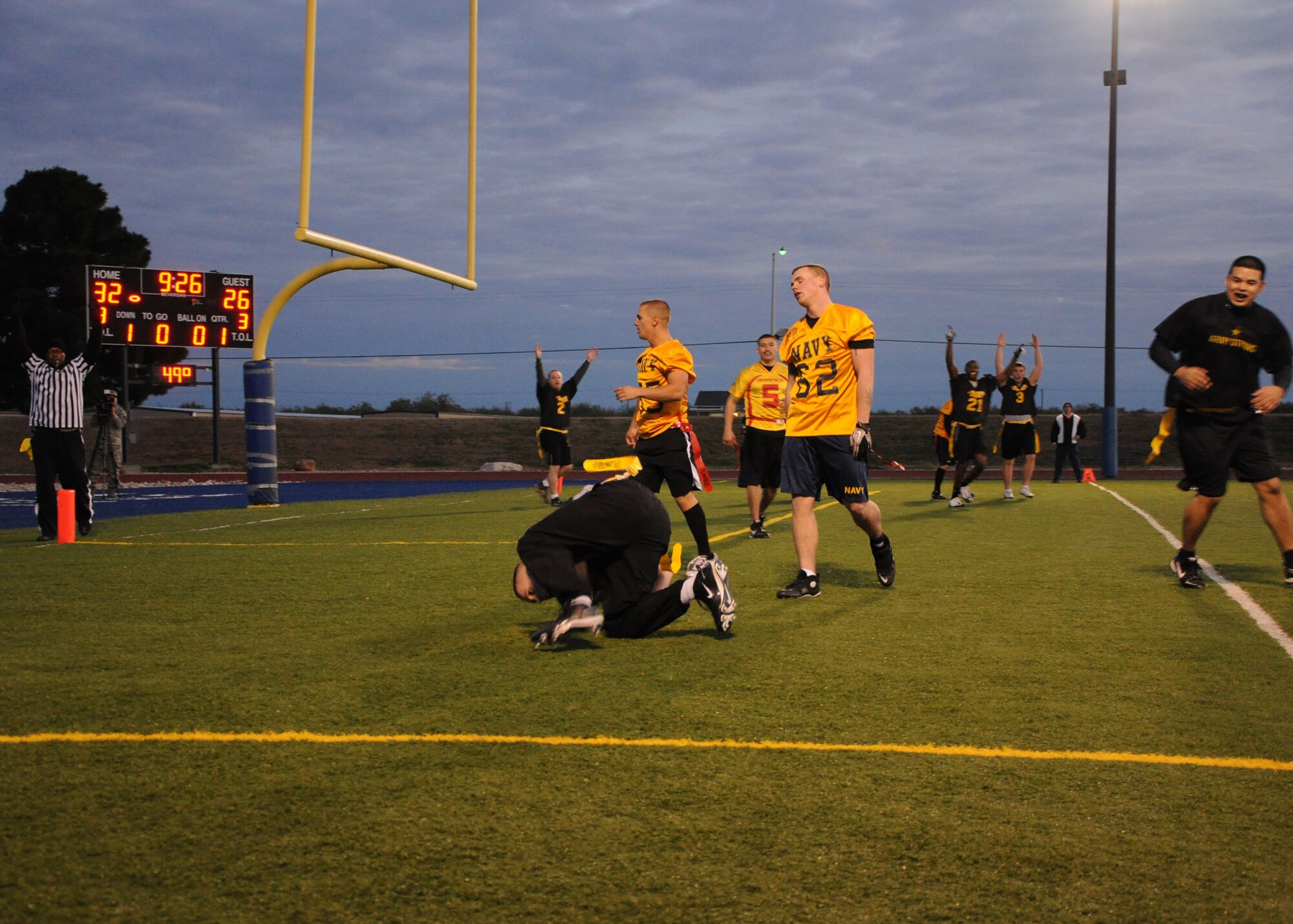 GOODFELLOW AIR FORCE BASE, Texas – U.S. Army team members react to a third quarter touchdown pass during the Third Annual Army versus Navy flag football game at the base field Dec. 17. Army defeated Navy 45-32 for the third consecutive year. (U.S. Air Force photo/ Staff Sgt. Tong Duong)