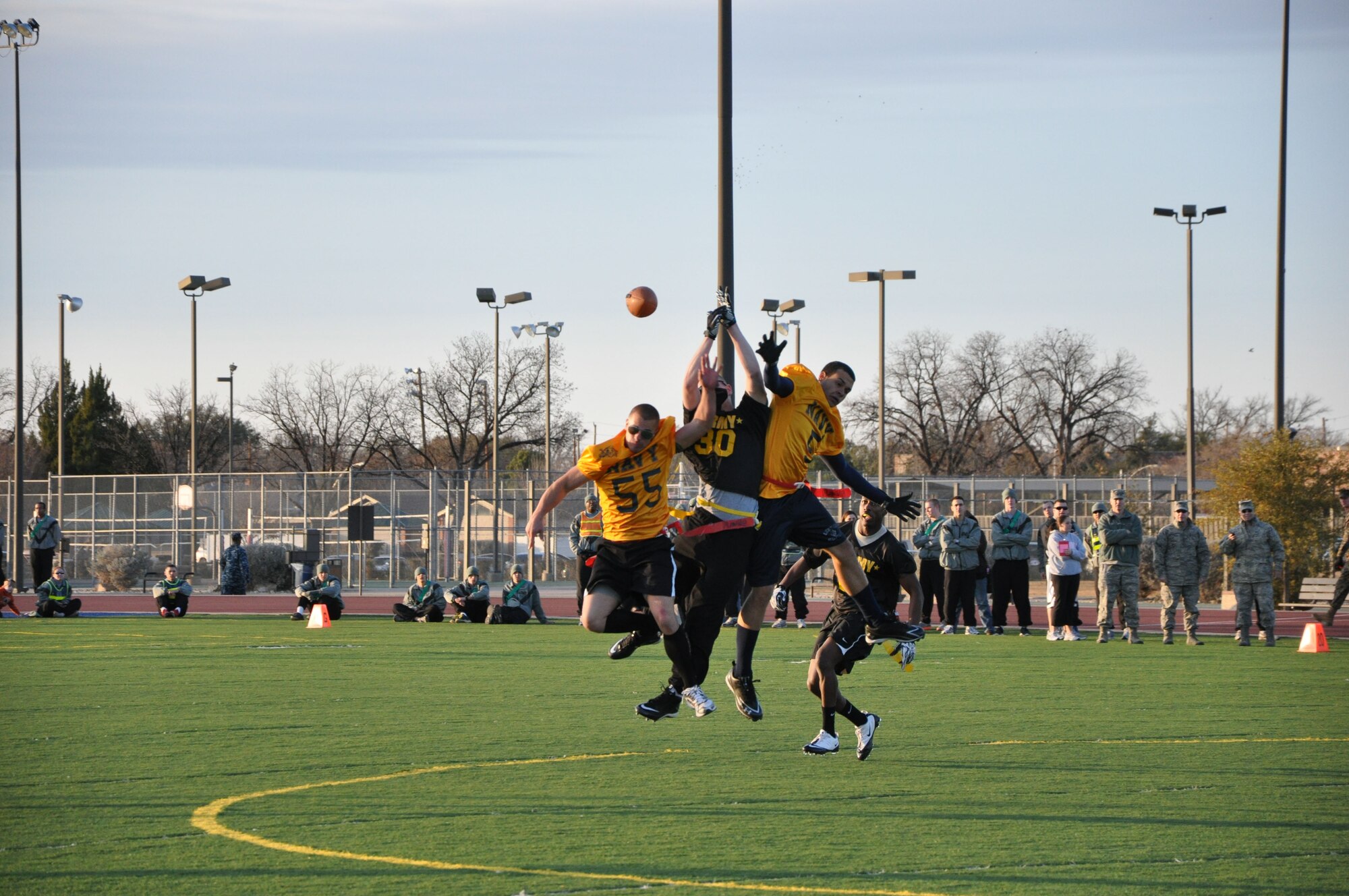 GOODFELLOW AIR FORCE BASE, Texas – U.S. Navy Sailors block a pass to an Army receiver during the Third Annual Army versus Navy flag football game at the base field Dec. 17.  (U.S. Air Force photo/ Staff Sgt. Tong Duong)