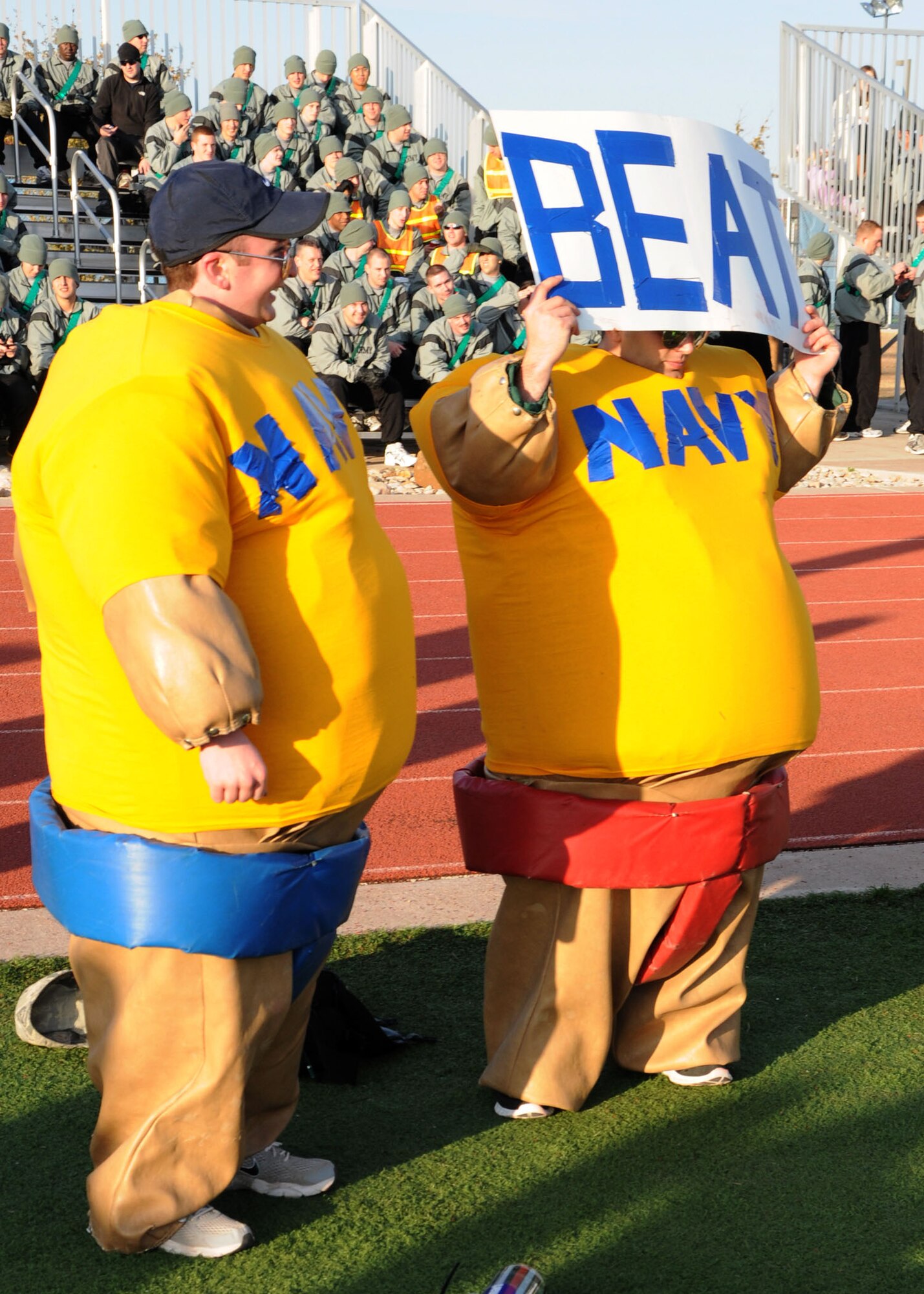 GOODFELLOW AIR FORCE BASE, Texas – Unidentified Soldiers do their part to break the concentration of their rivals during the Third Annual Army versus Navy flag football game at the base field Dec. 17. Army defeated Navy 45-32 for the third consecutive year. (U.S. Air Force photo/ Staff Sgt. Tong Duong)