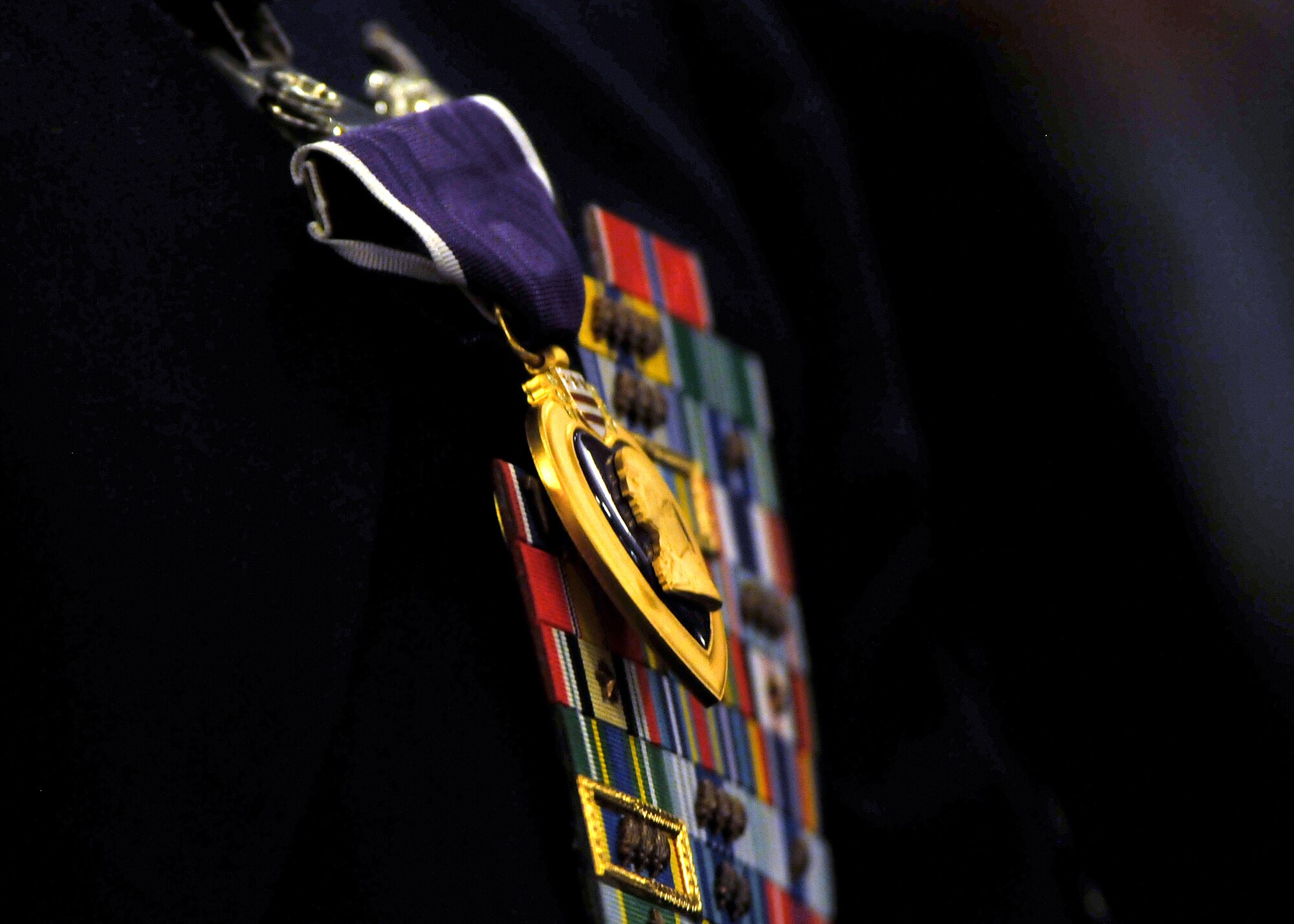RAMSTEIN AIR BASE, Germany -- A Purple Heart medal rests on the chest of Tech. Sgt. Richard Chwalik, Headquarters U.S. Air Forces in Europe A4 command equipment manager.  Chairman of the Joint Chiefs of Staff, Gen. Martin E. Demplsey presented the Purple Heart medal to Chwalik Dec. 19 at a town hall meeting during the chairman's visit here.  Chwalik was injured during his deployment to Afghanistan in 2009. (U.S.Air Force photo by Tech. Sgt. Markus M. Maier/Relased)
