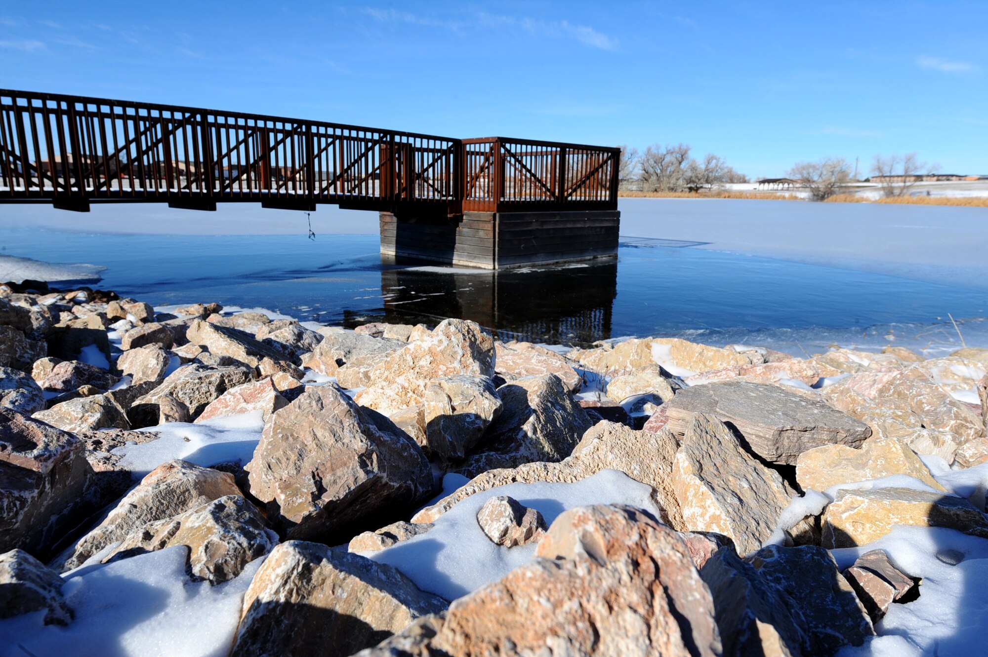 Bandit Lake sits silently during the winter on Ellsworth Air Force Base, S.D., Dec. 6, 2011. Bandit Lake is one of four lakes on Ellsworth available to Airmen and their families for fishing and outdoor recreational activities during the summer months. (U.S. Air Force photo by Airman 1st Class Zachary Hada/Released)