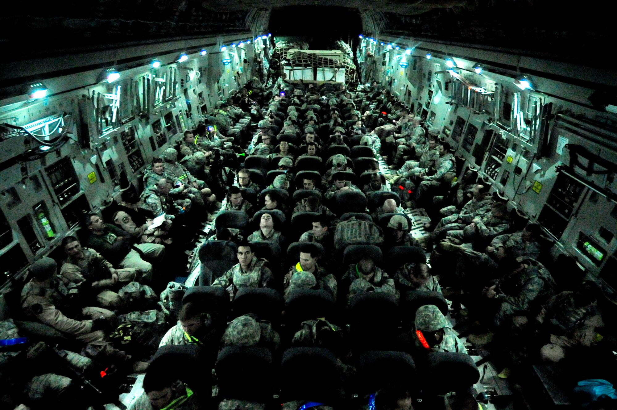 Airmen assigned to the 407th Air Expeditionary Group prepare to take off on a C-17 Globemaster III Dec. 18, 2011, at Ali Air Base, Iraq. The Airmen are the last service members to leave Iraq. Since 2003, more than one million service members have served in Iraq. (U.S. Air Force photo/Master Sgt. Cecilio Ricardo)