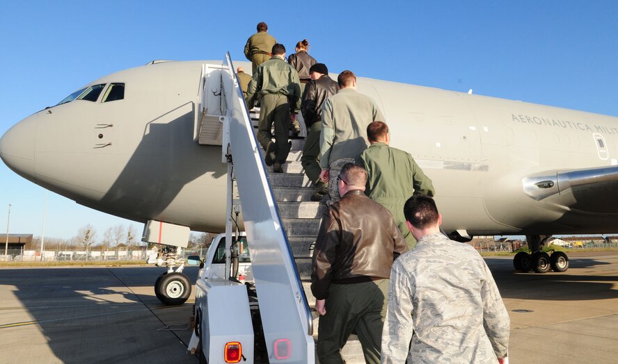 RAF MILDENHALL, England – Aircrew and support personnel from here board an Italian Air Force KC-767 Dec. 9, 2011. The military members had the opportunity to look around the aircraft and learn more about its capabilities, when members from the Italian air force flew here as part of an exchange program to build international relations. (U.S. Air Force photo/Karen Abeyasekere)