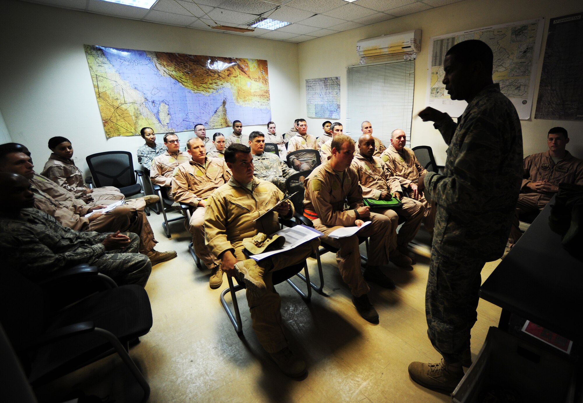 U.S. Air Force and Army personnel receive a crew brief from Colonel Randal Reed, 379th Expeditionary Operations Group Commander, before departing to escort the last ground convoy out of Iraq 18 Dec, 2011. This was the last Joint Surveillance Target Attack Radar System (JSTARS) combat mission over Iraqi air space. The JSTARS provided airborne, stand-off range, surveillance and target acquisition radar and command and control capabilities to ground personnel. (U.S. Air Force photo/ Tech. Sgt. DeNoris A. Mickle)

