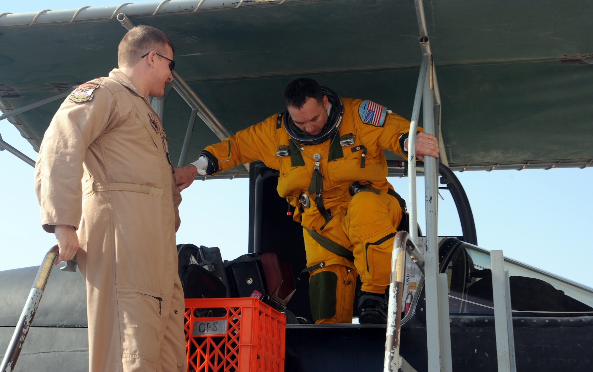 SOUTHWEST ASIA - Maj. Steve Eadie climbs out of his U-2 aircraft after completing the final manned ISR flight over Iraq Dec. 18, 2011. Members of the 380th Air Expeditionary Wing have been flying intelligence, surveillance and reconnaissance missions over Iraq to provide senior leaders with the information they need to make decisions. The major, a native of Lake City, Fla., is deployed from Beale Air Force Base, Calif. (U.S. Air Force photo/Staff Sgt. J.G. Buzanowski)
