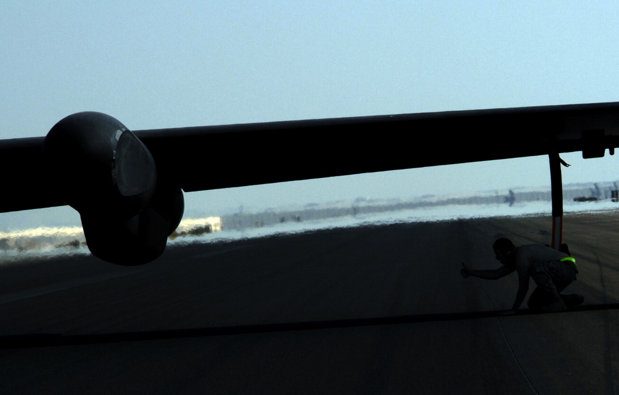 SOUTHWEST ASIA - Staff Sgt. Christopher Todd signals a thumbs up to the rest of the team as the recovery crew inserts wheel struts into the wings of a U-2 after the pilot completed the final manned ISR flight over Iraq Dec. 18, 2011. Members of the 380th Air Expeditionary Wing have been flying intelligence, surveillance and reconnaissance missions over Iraq to provide senior leaders with the information they need to make decisions. (U.S. Air Force photo/Staff Sgt. J.G. Buzanowski)