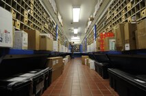 Airmen at the Kunsan Post Office continue to receive and separate holiday mail faster than Santa’s workshop can make toys. An Airman is seen organizing mail at Kunsan Air Base, Republic of Korea, Dec. 19, 2011. (U.S. Air Force photo by Senior Airman Jessica Hines/Released)