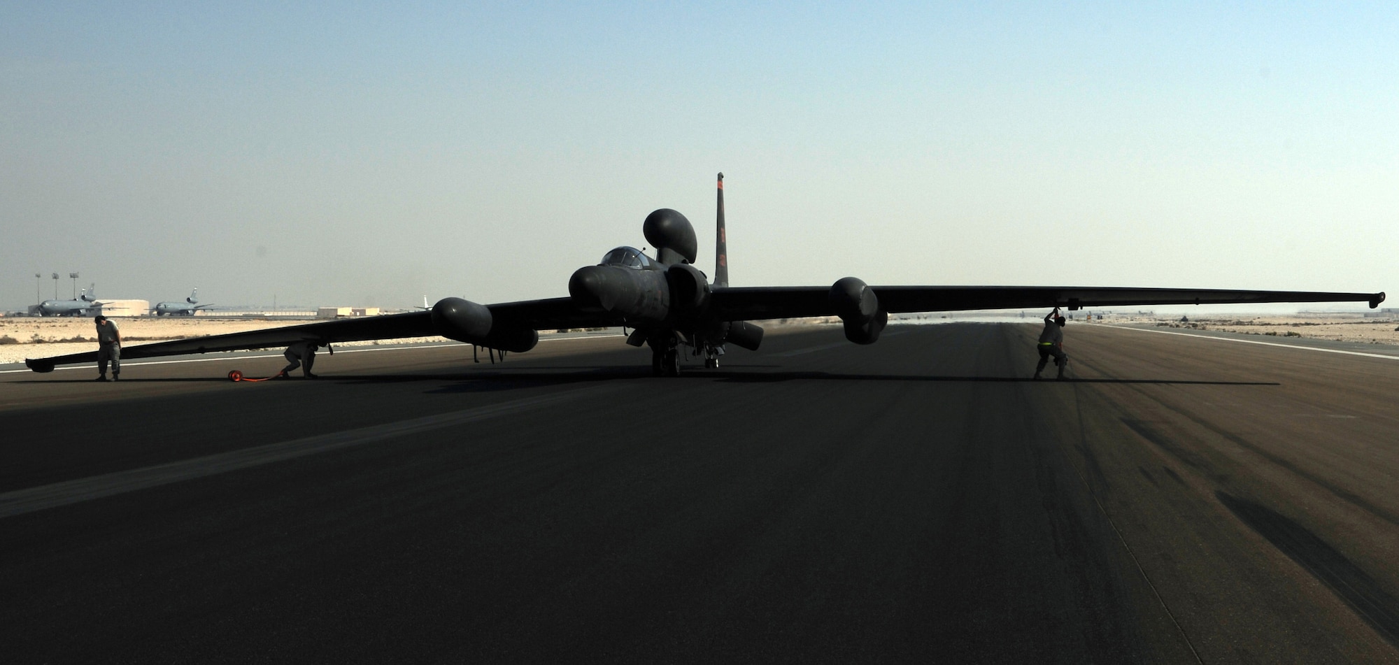 SOUTHWEST ASIA - A recovery crew inserts wheel struts into the wings of a U-2 after the pilot completed the final manned ISR flight over Iraq Dec. 18, 2011. Members of the 380th Air Expeditionary Wing have been flying intelligence, surveillance and reconnaissance missions over Iraq to provide senior leaders with the information they need to make decisions. (U.S. Air Force photo/Staff Sgt. J.G. Buzanowski)