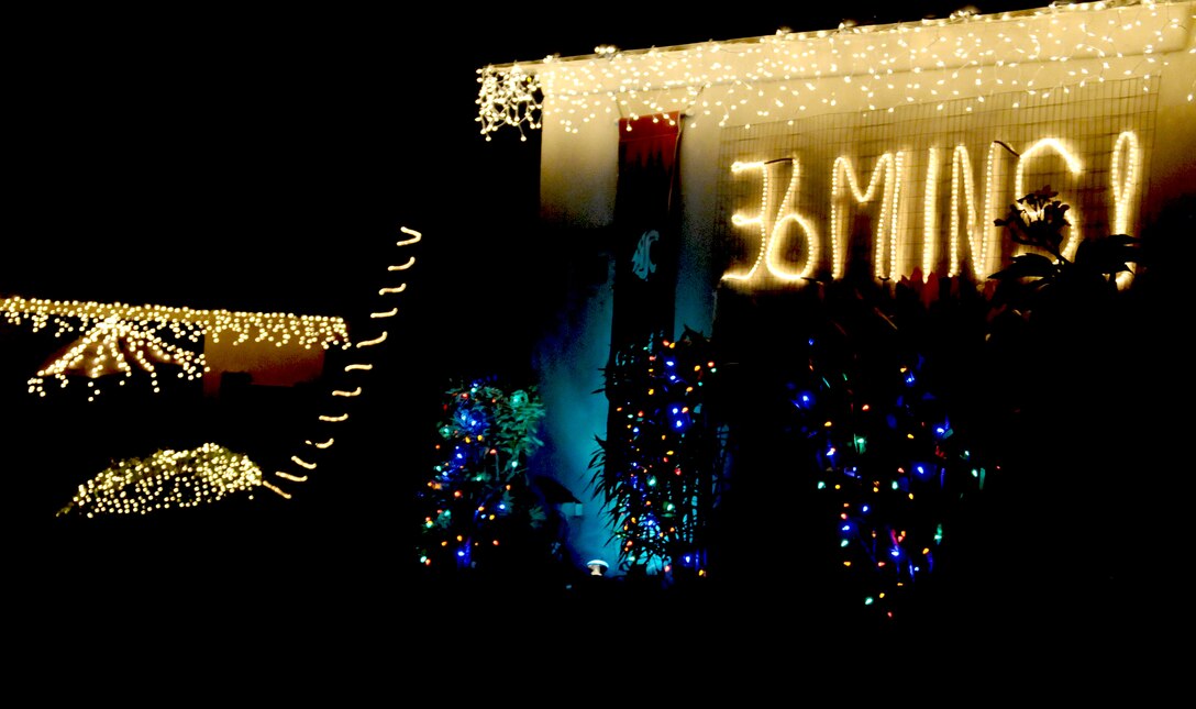 ANDERSEN AIR FORCE BASE, Guam—Each house on Rota Drive was lit with Christmas lights as the Andersen community toured during the holiday season here, Dec. 17. Nearly 50 houses along the road were decorated by different groups and units to bring a feel of the holiday season to the tropical island. (U.S. Air Force photo by Senior Airman Benjamin Wiseman/Released)