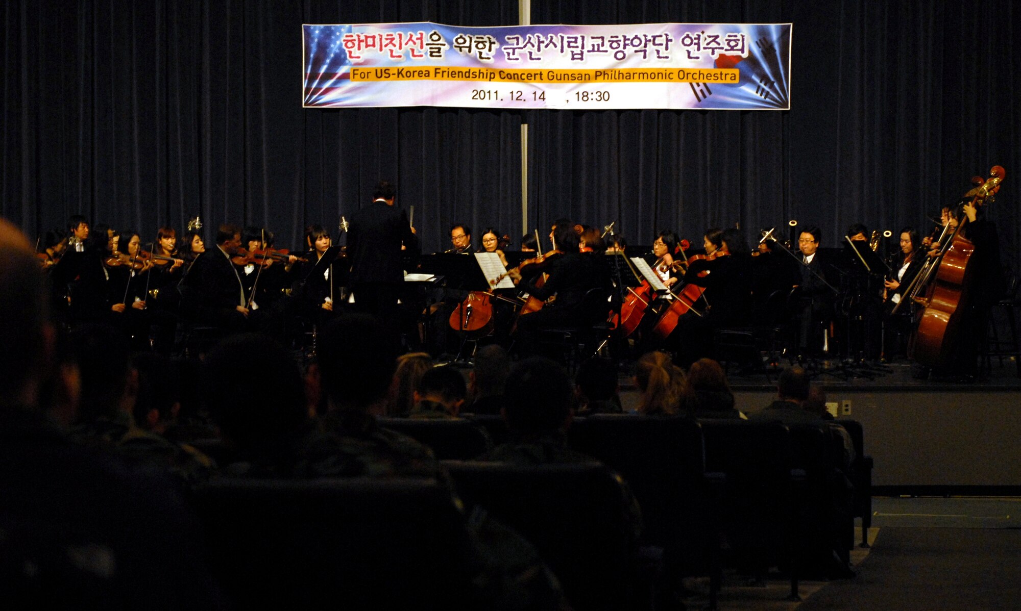The Gunsan Philharmonic Orchestra brought holiday cheer to Kunsan’s Wolf Pack in the form of a U.S.-Korea Friendship Concert in the base theater at Kunsan Air Base, Republic of Korea, Dec. 14, 2011. Members of both the U.S. Air Force and Republic of Korea Air Force joined the orchestra in song as they celebrated the special time of year together as one family working to accomplish one mission for the ROK. (U.S. Air Force photo by Senior Airman Derrick Schwieters/Released)