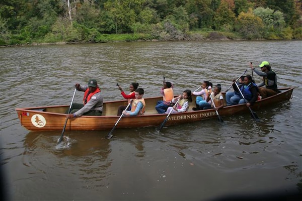 Washington D.C. -- Theodis Williams, park ranger with Mobile District (left), leads a group of school children on a canoe ride of the Anacostia River during the Urban Wilderness Canoe Adventures program, which began Oct. 24 and lasted one week.  