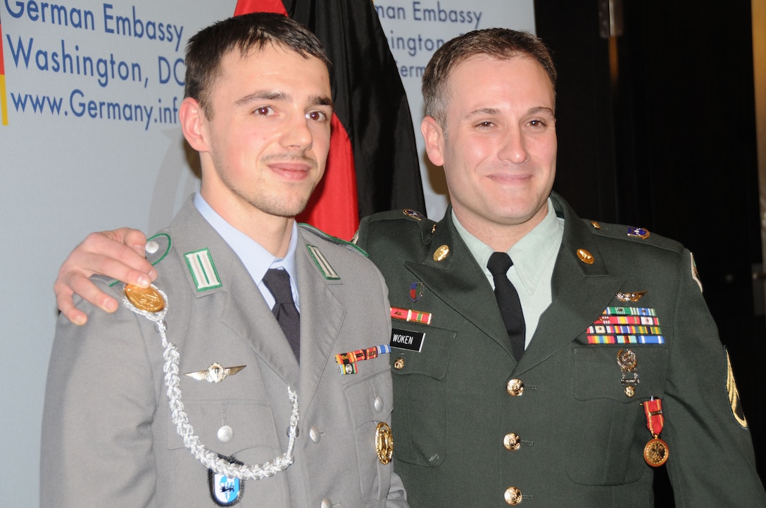 German army Cpl. Tim Focken and U.S. Army Staff Sgt. Peter Woken meet following a ceremonyat the home of the German ambassador in Washington, D.C., Dec. 8, 2011. During the event, Woken was awarded the German Medal of Honor for Gallantry in Action for saving Focken's like in Afghanistan. U.S. Army photo by C. Todd Lopez