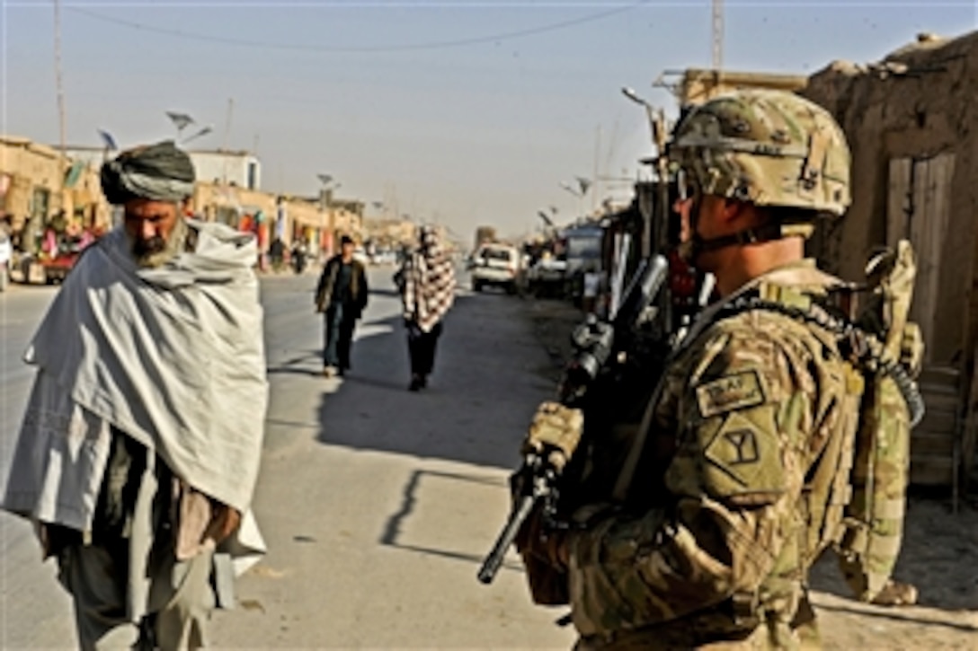 U.S. Army Spc. Jason Bruno secures an area during an assessment of the local bazaar in the Shah Joy district of Zabul province, Afghanistan, on Dec. 7, 2011.  Bruno is a rifleman assigned to Provincial Reconstruction Team Zabul.  