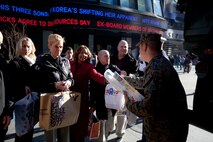 NEW YORK -- Marines from 6th Communication Battalion, a Marine Forces Reserve unit based in Floyd Bennett Field, Brooklyn, collect toys in Times Square as part of their Toys for Tots drive, Dec. 19. The Marines will be in Times Square all week loading up their tactical vehicles with toys collected from all of their New York City drop off locations as part of their final collection effort. Last year the Marines from 6th Communication Battalion collected approximately 280,000 toys, the majority of them being collected during this last-week scramble before Christmas. (Official Marine Corps photo by Cpl. Caleb Gomez / RELEASED)