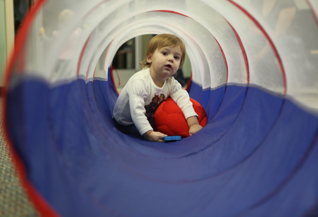 A child plays in a tunnel during Midway Parks Community Play Date Dec. 20. Parents requested a program where children could play in an unstructured environment.