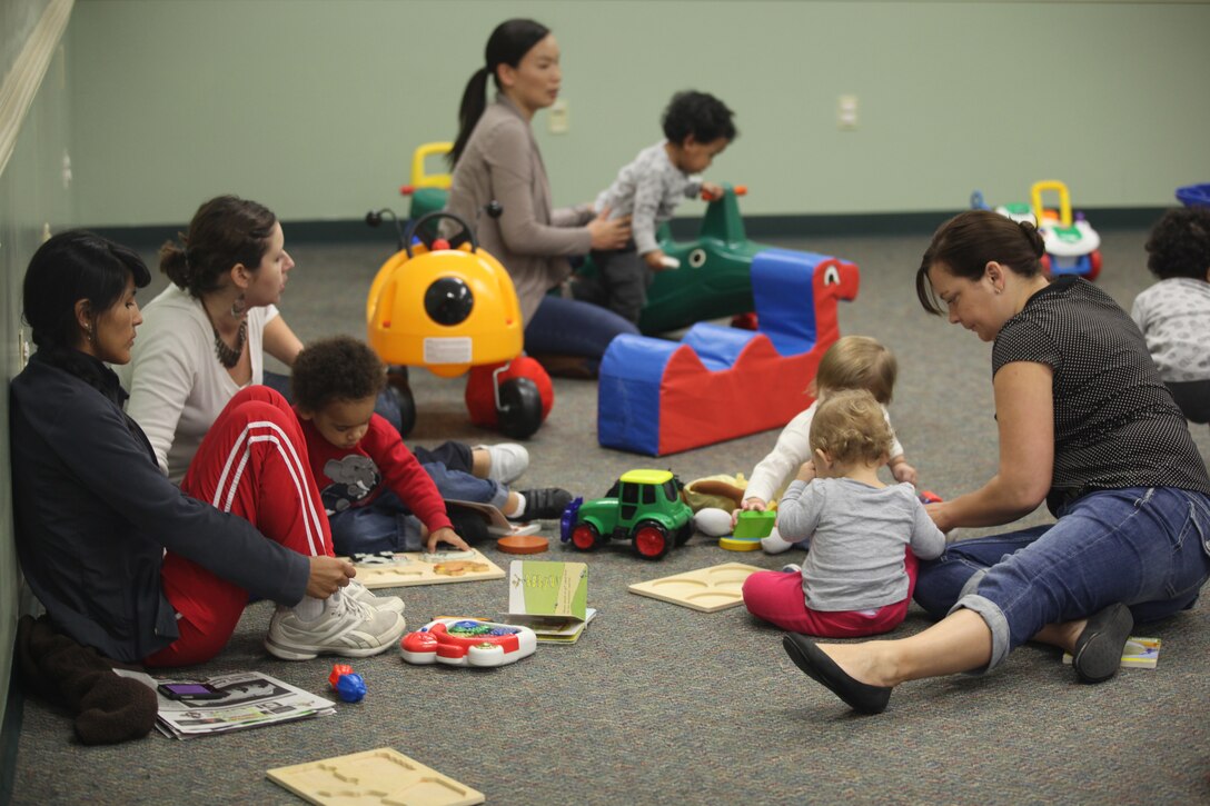 Mothers play with their children at Midway Park's Community Play Date Dec. 20. The free, weekly event gives parents the opportunity to mingle as well as giving their children a place to play.