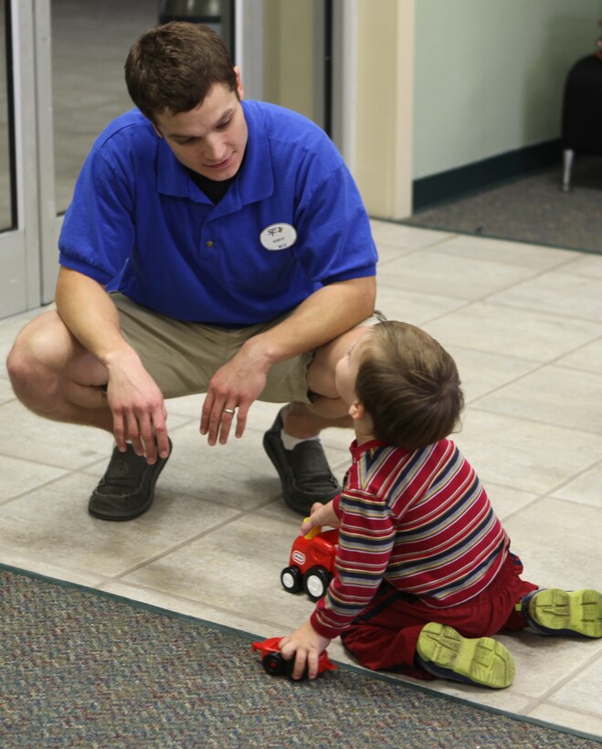 An employee of Midway Park Community Center drops in during it's weekly Community Play Date Dec. 20. Community Play date is a free weekly event for families aboard Marine Corps Base Camp Lejeune.