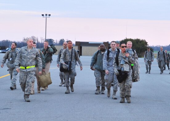 Seymour Johnson families had several reasons to celebrate as several Airmen returned from a deployment to Bagram Airfield, Afghanistan, on Seymour Johnson Air Force Base, N.C., Dec. 20, 2011. Many of the Airmen were from the 4th Aircraft Maintenance Squadron, which includes career fields such as avionics, crew chiefs and specialists who are in charge of maintaining F-15E Strike Eagles wherever they are needed in the world. (U.S. Air Force photo by Senior Airman Marissa Tucker)
