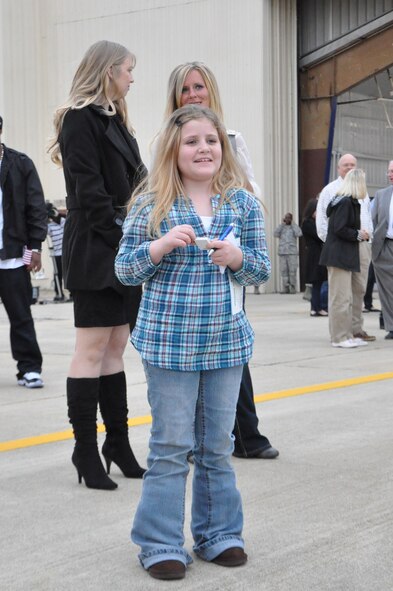 Alyssa Rasko waits for her father, Staff Sgt. Robert Abolos, 4th Equipment Maintenance Squadron weapons specialist to return home on Seymour Johnson Air Force Base, N.C., Dec. 20, 2011. Abolos was greeted by his wife and daughter after returning home from a deployment to Bagram Airfield, Afghanistan. (U.S. Air Force photo by Airman 1st Class Mariah Tolbert)