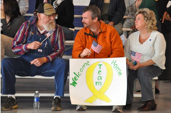 Barry and Kathy Foxx talk with Ray Burgark while waiting for their Airmen to arrive at Seymour Johnson Air Force Base, N.C., Dec. 20, 2011. Family and friends waited for the return of their Airmen who are slated to return over the next few days from Bagram Airfield, Afghanistan. The Foxx’s are awaiting the arrival of their son, Airman 1st Class William Foxx, 4th Equipment Maintenance Squadron munitions flight, and Burgark is expecting his son, Senior Airman Christopher Mabe, 335th Aircraft Maintenance Unit crew chief. (U.S. Air Force photo by Airman 1st Class Mariah Tolbert) 