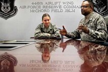 Senior Master Sgt. Stephen Harris, right, and Staff Sgt. Andrea Barrow, Reservists with the 446th Airlift Wing, talk about the emotions they've felt while working at the Air Force Mortuary Affairs Operations Center at Dover Air Force Base, Del. During an interview at McChord Field, Dec. 14, 2011, the two spoke of the compassion one must have to do their jobs. Barrow adds "What's always in your mind is the dignity, honor and respect of this fallen hero." (photo courtesy/Janet Jensen of the Tacoma News Tribune)