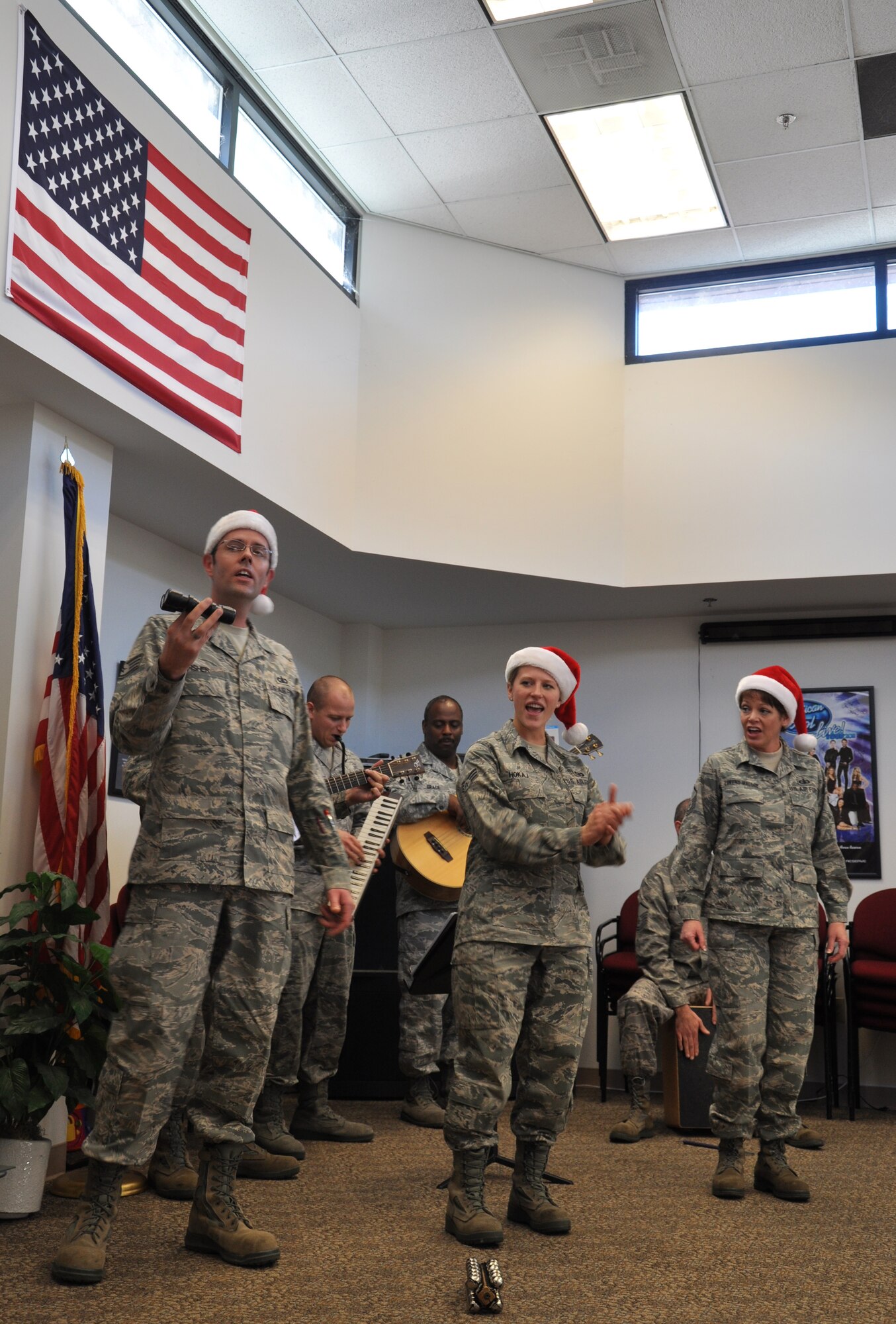 Members of the band Mobility perform holiday music at the 940th Reserve Wing headquarters building at Beale Air Force Base Calif., Dec. 14, 2011. The band is subdivision of the U.S. Air Force Band of the Golden West based at Travis AFB. (U.S. Air Force photo by Staff Sgt. Robert M. Trujillo/Released)