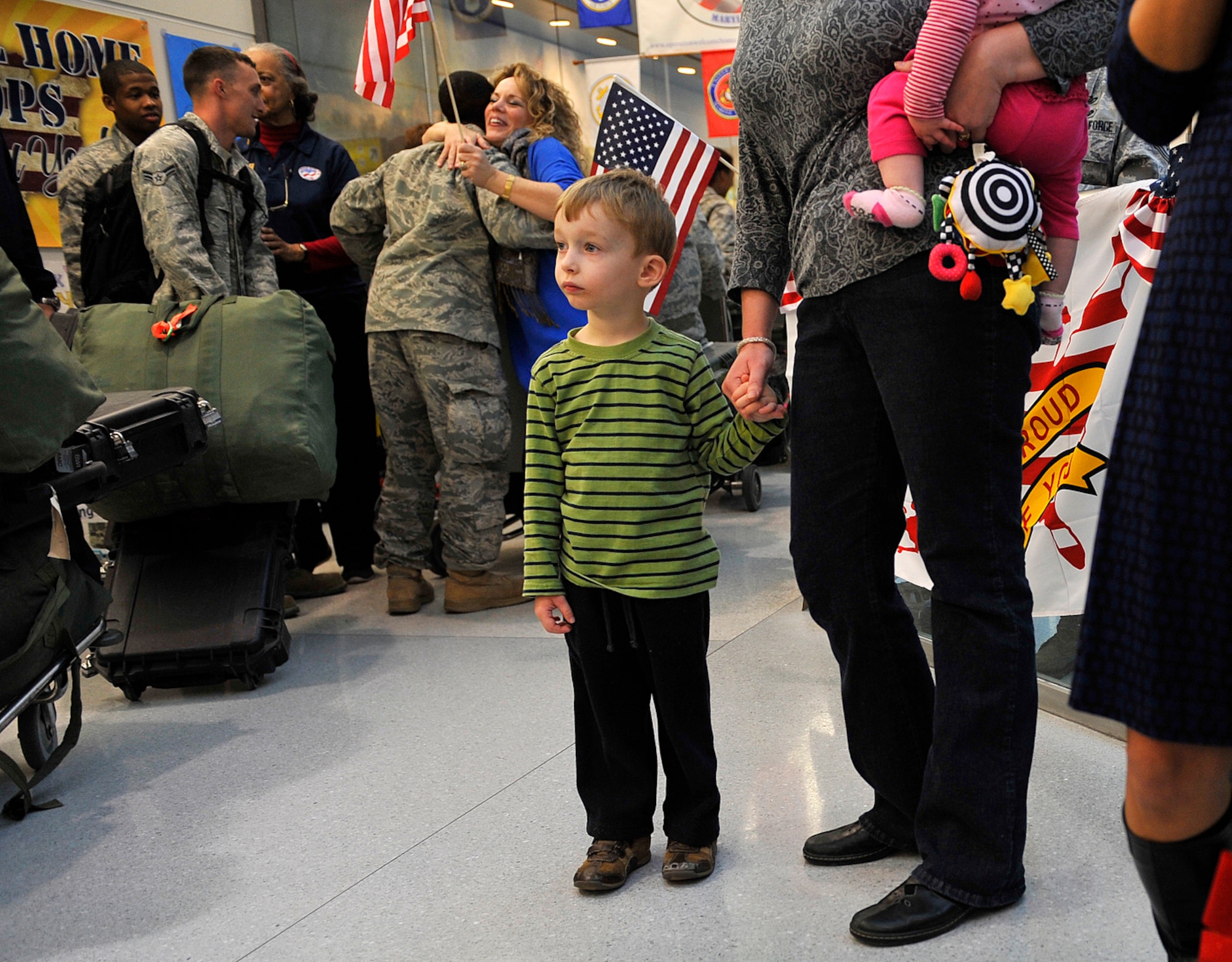 Connor Vilpors waits to greet his father Dec. 20, 2011, at Baltimore/Washington International Thurgood Marshall Airport in Baltimore, Md. Connor's father, Lt. Col. Steven Vilpors, was deployed to Iraq and was one of the last Airmen to return home from supporting the completed Operation New Dawn. (U.S. Air Force photo/Tech. Sgt. Bennie Davis)