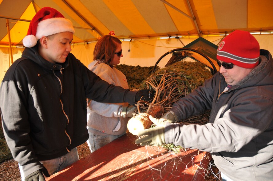 Guardsmen from Springfield Air National Guard Base volunteer at the eighth annual Ed Williams Christmas Tree Sale in Springfield, Ohio. This is Interfaith Hospitality Network of Springfield's biggest fundraiser.  IHN has made great strides in helping those in need by offering programs and facilities that serve the homeless and those in need of shelter in the Springfield/Clark County communities. (U.S. Air Force photo by Staff Sgt. Amy N. Adducchio/Released)