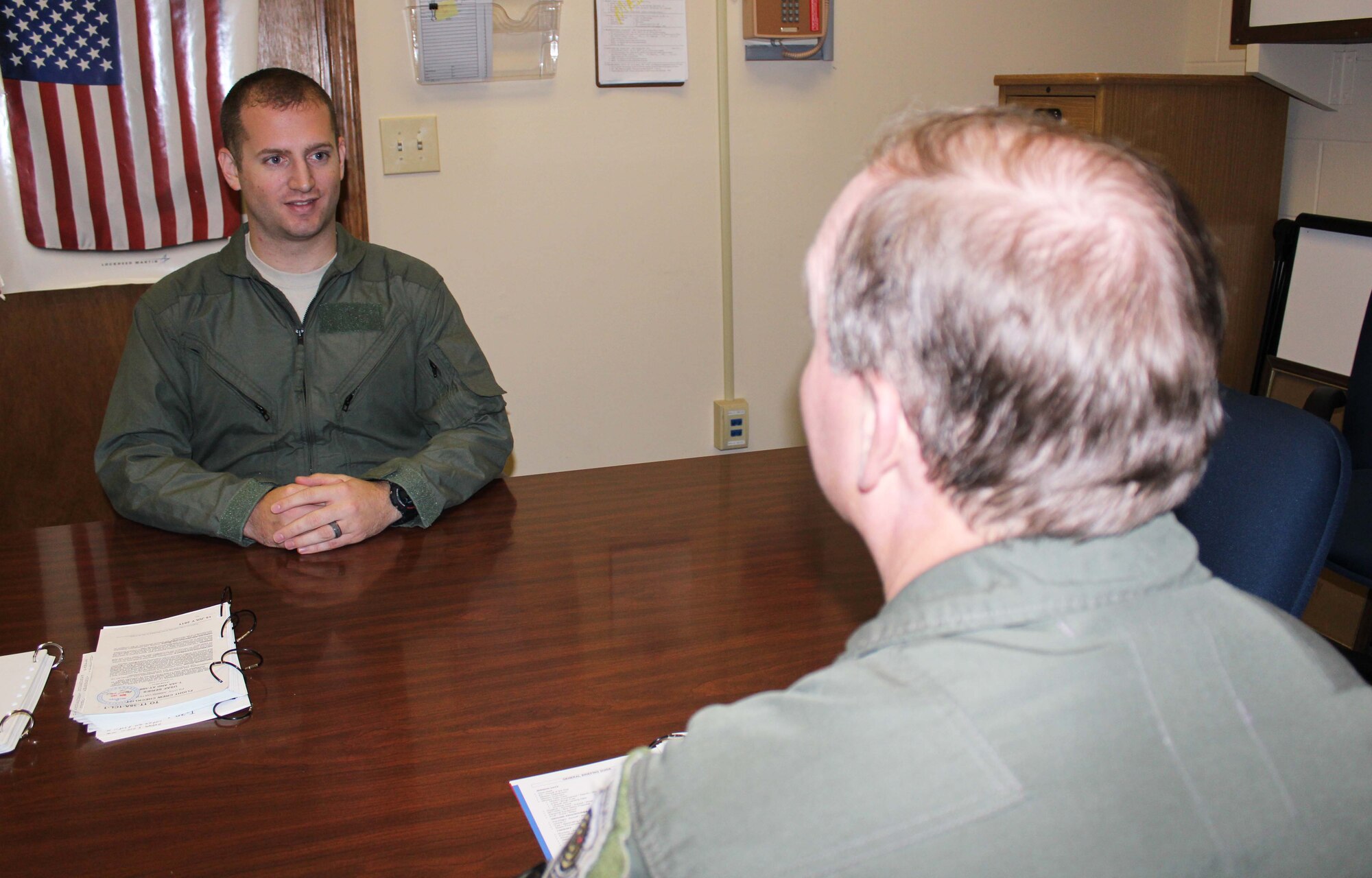 Staff Sgt. Stephen McGuire, a command and control systems administrator from the 601st Air and Space Operations Center, receives a flight brief from Mike MacWilliam, a pilot from the 53rd Weapons Evaluation Group, at Tyndall Air Force Base, Fla., Dec. 15. McGuire, who was the 601st AOC’s Airman of the Year, received an incentive flight in an F-4 as part of a new initiative designed to provide more rewards to the command’s top enlisted performers. (U.S. Air Force photo by Angela Pope)