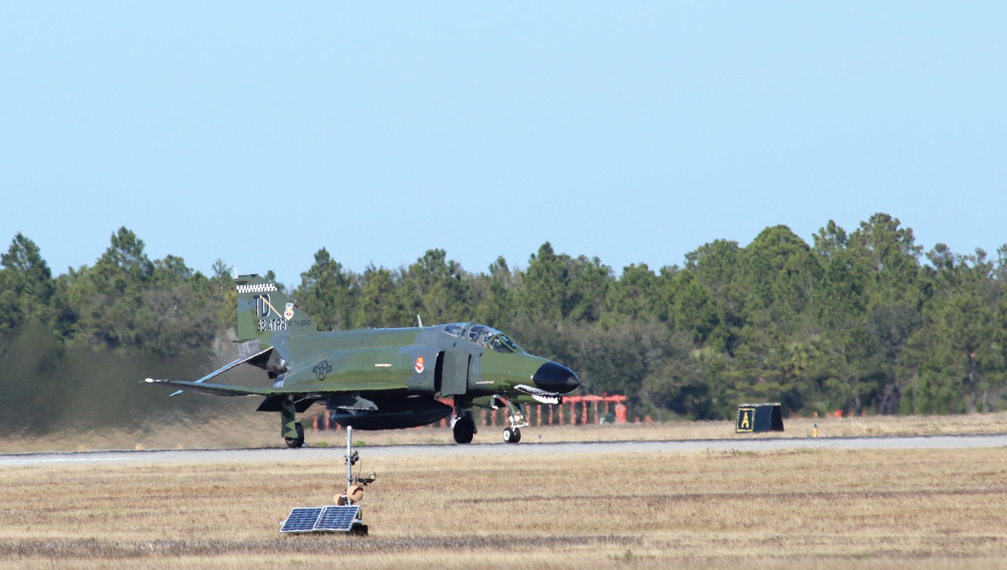 An F-4 Phantom rolls down the runway at Tyndall Air Force Base, Fla., Dec. 14. Four Airmen from the Continental U.S. North American Aerospace Defense Command Region-1st Air Force (Air Forces Northern) received incentive flights in an F-4 as part of a new initiative designed to provide more rewards to the command’s top enlisted performers. (U.S. Air Force photo by Angela Pope)