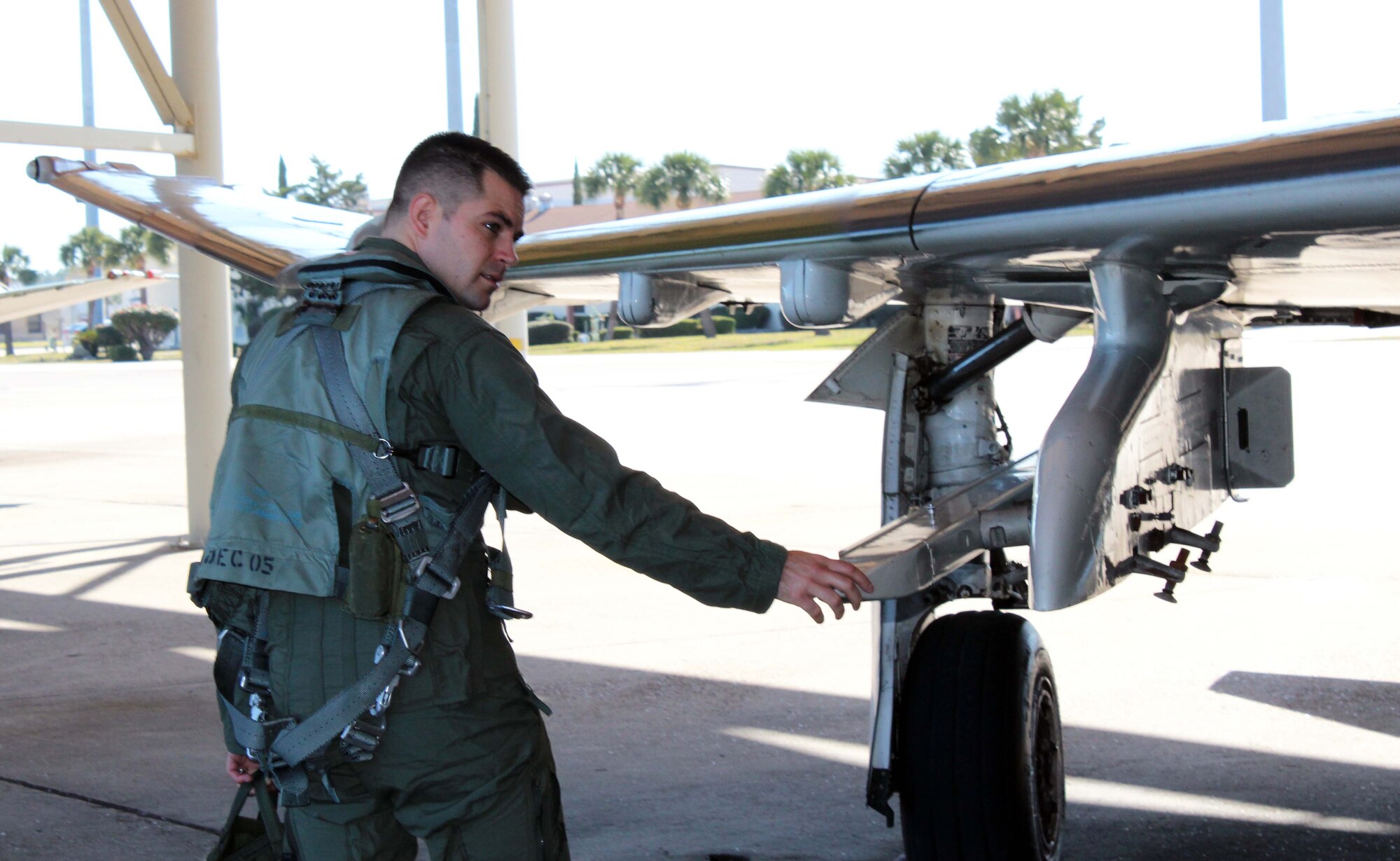 Staff Sgt. Brett Dunning, an intelligence analyst from the 601st Air and Space Operations Center and a former F-15 crew chief, does a pre-flight check on an F-4 Phantom at Tyndall Air Force Base, Fla., Dec. 14. Dunning, who was the 601st AOC’s Noncommissioned Officer of the Year, received an incentive flight in an F-4 as part of a new initiative designed to provide more rewards to the command’s top enlisted performers. (U.S. Air Force photo by Angela Pope)