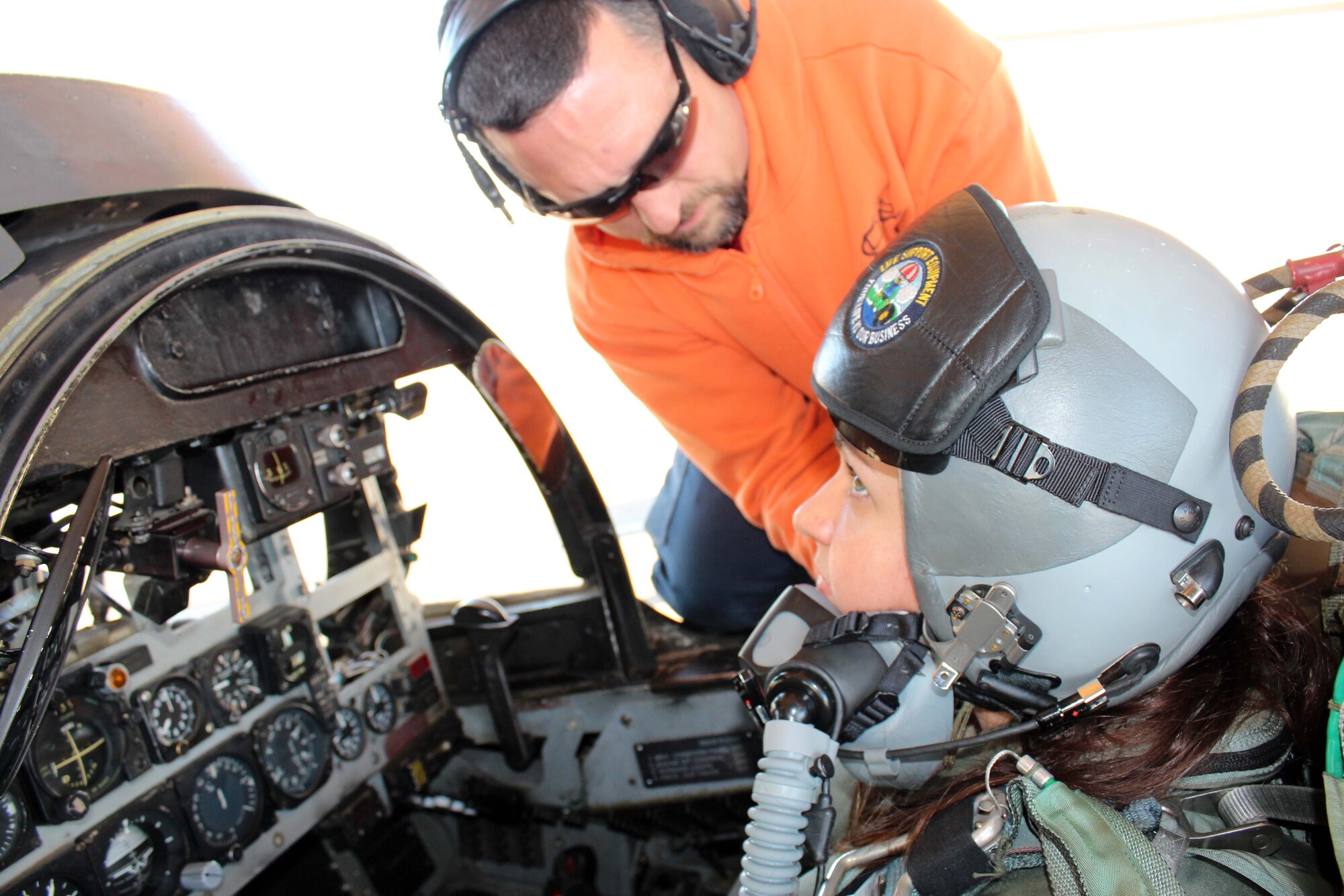 A crew chief checks the helmet of Senior Airman Jillian Goins, a search and rescue controller from the Air Force Rescue Coordination Center, at Tyndall Air Force Base, Fla., Dec. 14. Goins, who was 1st Air Force’s Airman of the Quarter, received an incentive flight in an F-4 Phantom as part of a new initiative designed to provide more rewards to the command’s top enlisted performers. (U.S. Air Force photo by Angela Pope)