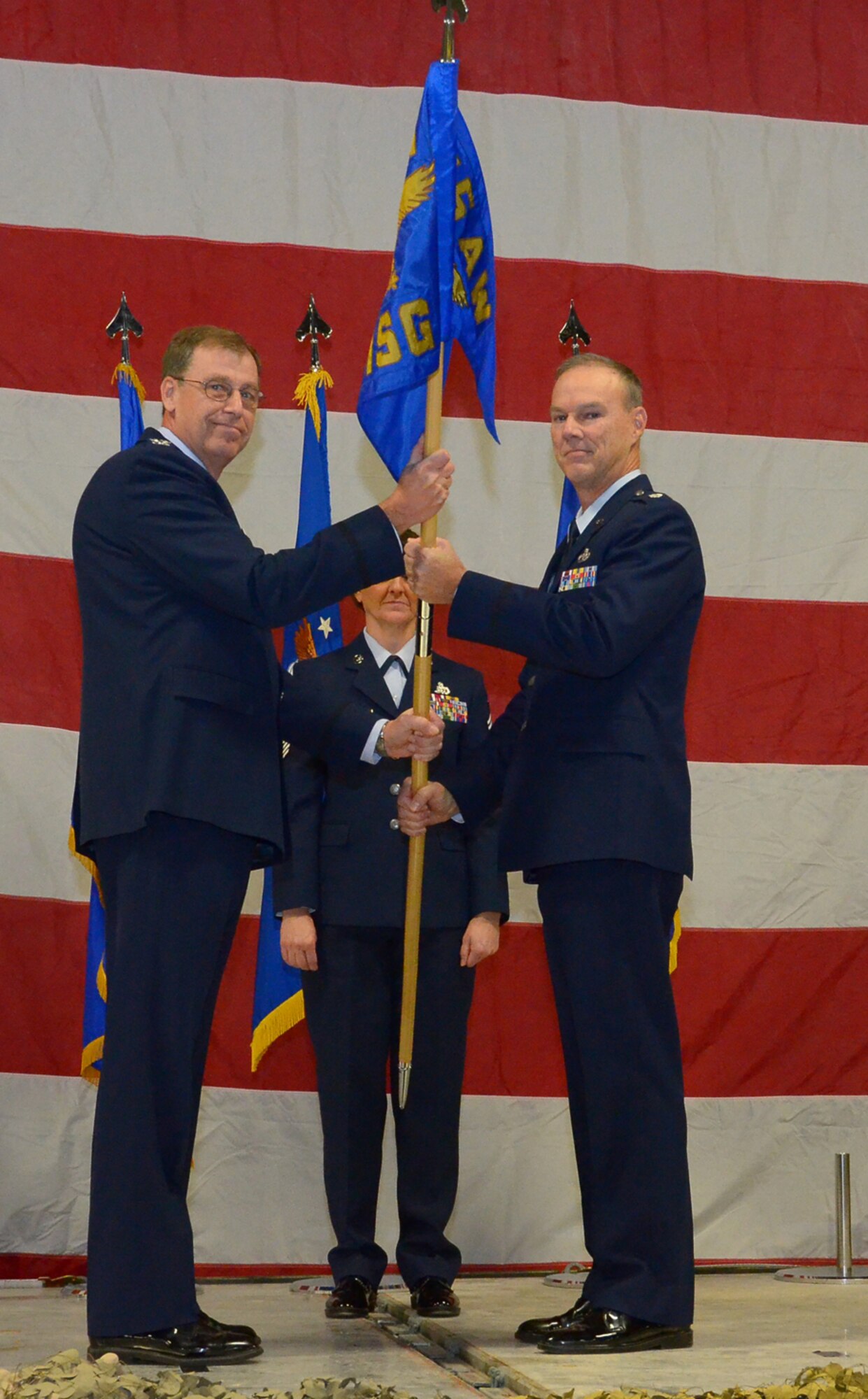 WRIGHT-PATTERSON AIR FORCE BASE, Ohio – Col. Stephen Goeman, 445th Airlift Wing commander, passes the guidon to Lt. Col. Dale Bateman, incoming 445th Mission Support Group commander, during the Dec. 4 Appointment of Command ceremony. Bateman was the 459th Mission Support Group commander at Joint Base Andrews, Md., prior to his new position here. (U.S. Air Force photo/Senior Airman Mikhail Berlin)