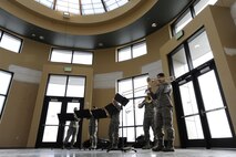 MINOT AIR FORCE BASE, N.D. -- The U.S. Air Force Heartland of America Band performs Christmas music medleys in the Atrium of the 91st Missile Wing training facility here Dec. 16. The band toured Minot AFB for three days, performing at various locations, spreading good cheers and improving morale. (U.S. Air Force photo/Airman 1st Class Stephanie Ashley)