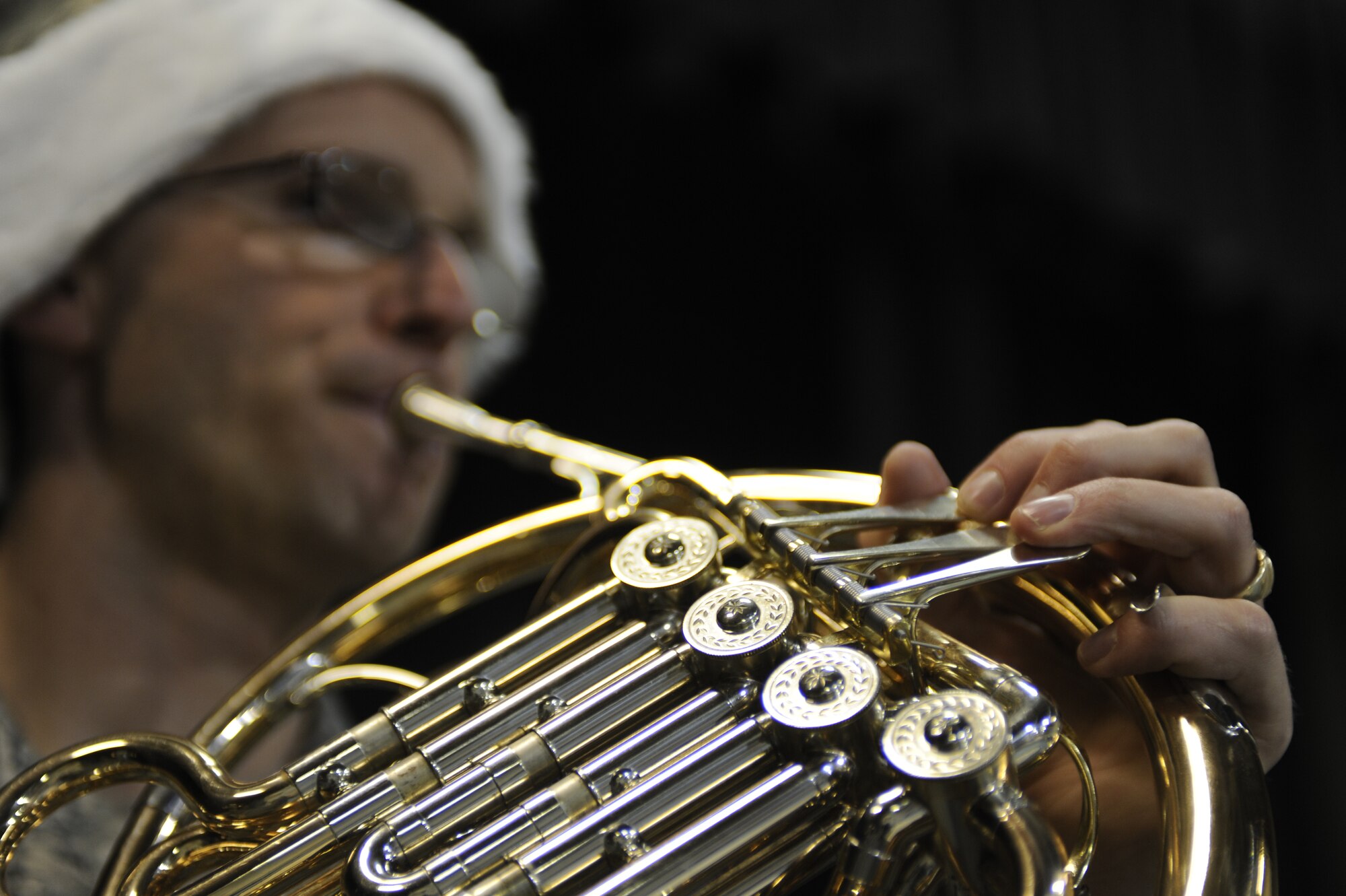MINOT AIR FORCE BASE, N.D. – Tech. Sgt. Patrick Heseltine, U.S. Air Force Heartland of America Band French-horn player, performs at the Dakota Elementary School here Dec. 14. The band toured Minot AFB for three days, performing at various locations, spreading good cheers and improving morale. (U.S. Air Force photo/Airman 1st Class Stephanie Ashley)