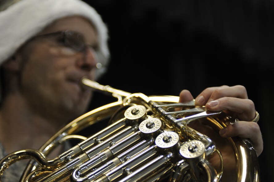 MINOT AIR FORCE BASE, N.D. – Tech. Sgt. Patrick Heseltine, U.S. Air Force Heartland of America Band French-horn player, performs at the Dakota Elementary School here Dec. 14. The band toured Minot AFB for three days, performing at various locations, spreading good cheers and improving morale. (U.S. Air Force photo/Airman 1st Class Stephanie Ashley)