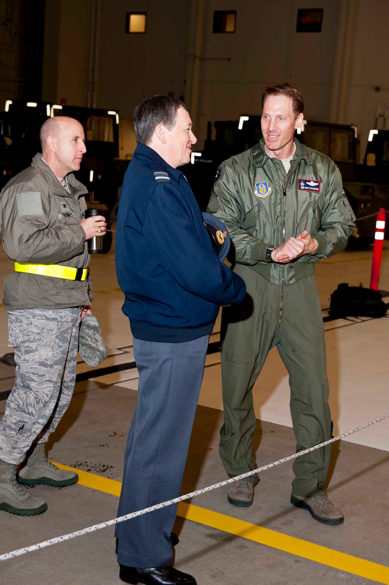 Lt. Col. David Piffarerio, 302nd Fighter Squadron commander and Col. Ed Thomas, 673rd Mission Support Group commander give Lord Maxwell Beaverbrook, Honorary Inspector General, Royal Auxiliary Air Force, a tour of an F-22 Dec. 13.  Lord Beaverbook is responsible for training for the American equivalent of the Royal Air Force Reserves and was visiting JBER to observe the integration between the active duty and Reserve Air Force units on JBER. (Courtesty Photo)