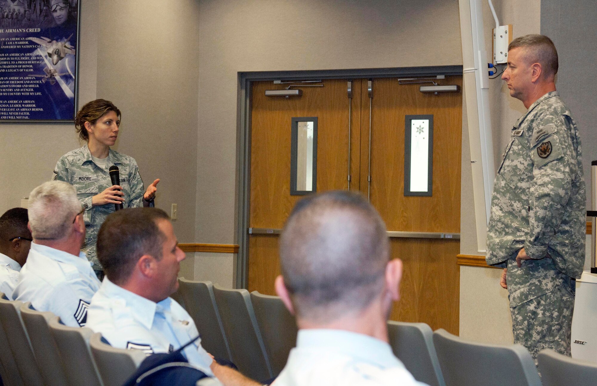 Master Sgt. Sherri Moore, Air Forces Northern communications directorate, poses a question to Army Command Sgt. Maj. Robert Winzenried during an enlisted call at Tyndall Air Force Base, Fla., Dec. 19. This was Winzenried’s first visit to Tyndall since he took over as the top enlisted leader at the North American Aerospace Defense Command and U.S. Northern Command Sept. 15. In addition to hosting an enlisted call during his visit, he also had breakfast with some of the Continental U.S. NORAD Region-1st Air Force (AFNORTH)’s enlisted award winners and toured the command, meeting with enlisted members at each stop. (U.S. Air Force photo by Christopher Cokeing) 