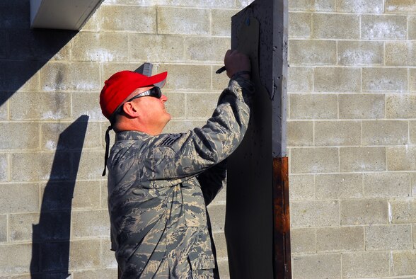 Prior to deploying in support of the POMLT 4 mission, members of the 171st Security Forces Squadron perform weapon qualification on the M-4 rifle and M-9 pistol. A police operational mentor and liaison team, POMLT4 will spend the next year training and teaching Afghan military and police on security tactics in Afghanistan. (National Guard photo by Tech. Sgt. Stacy Gault)